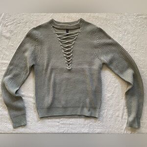 Green cross-knit sweater